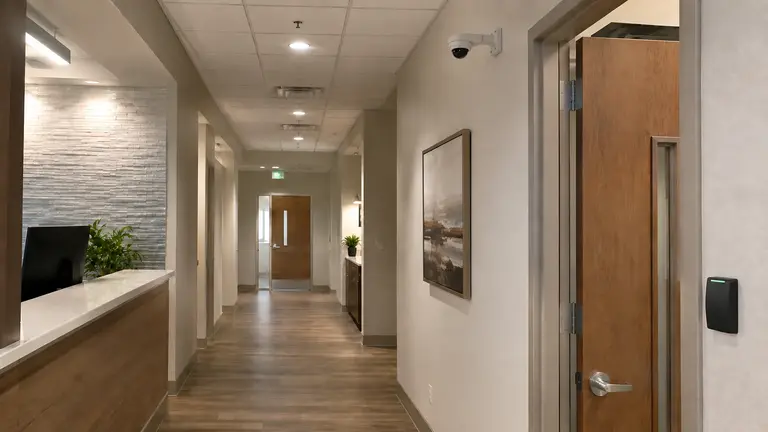 Healthcare reception corridor with a security camera and controlled entrance